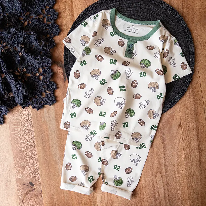 ست کامل تیشرت و شلوار راحتی بچه‌گانه با طراحی اسپرت فوتبال آمریکایی