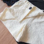 ست کراپ و دامن لاسیل طرح دکمه مشکی - Image 3