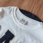 تیشرت و شلوارک سفید بچه‌گانه با لوگوی برند گپ