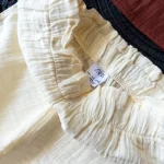 ست کراپ و شلوارک زارا طرح کرم قهوه‌ای - Image 3