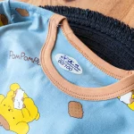 نمای نزدیک چاپ سگ کلاهدار روی ست بلوز و شلوار کودکانه