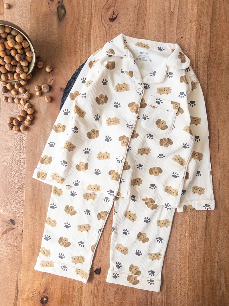 لباس راحتی بچگانه کرم جلو دکمه‌ای با طرح رد پای سگ و گربه