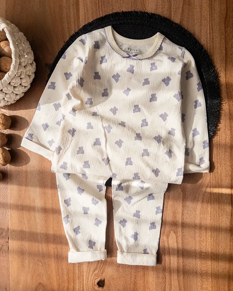 ست راحتی بچگانه بنفش با راه‌راه کرم و طرح خرس تدی